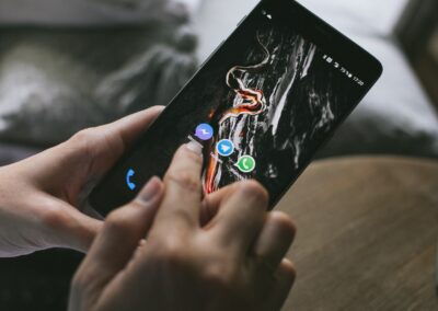 person selecting messenger on a smartphone